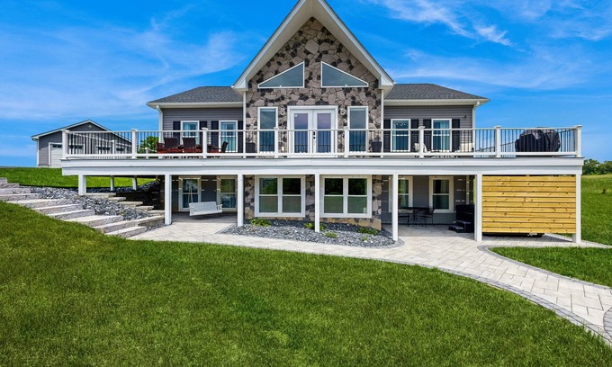 Orange House | Peaceful retreat with hot tub, fire pit, games, kayaks, and water view