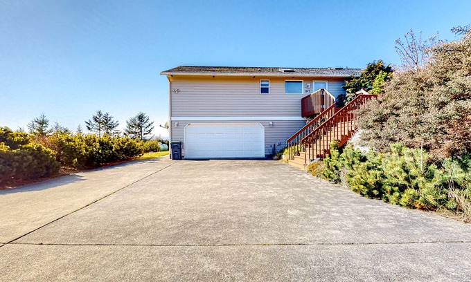Oak Harbor House | Peek-a-boo ocean view home with outdoor living space, W/D, and balcony