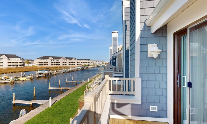 Heron Harbour Isle House | Pristine bay front townhome in Ocean City: Sweeping views, modern amenities
