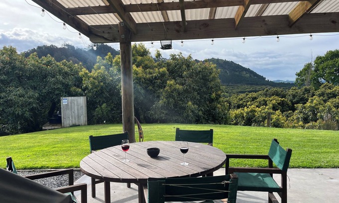 Richmond Downs House | Private Bach in Waihi Beach with stunning orchard views and beyond. Pet-friendly
