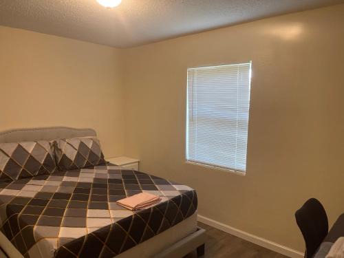 Fort Pierce North House | Private Queen Bedroom C shared common spaces