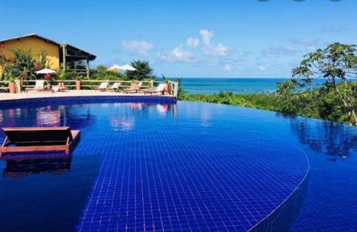Pescaria Apartment | Quarto e sala com piscina em Maceió - Villas Tulipa 02
