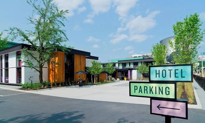 West Fens Hotel | Queen ADA Trailer Stay w/Vinyl Library, Outdoor Pool, Steps to Attractions!