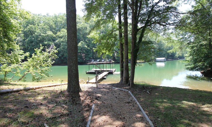 Gainesville House | Quiet lake cove home with single slip dock