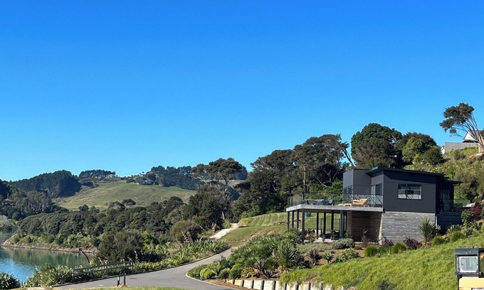 Raglan House | Rangitahi paradise. A modern 4 bedroom home overlooking the estuary in Raglan.