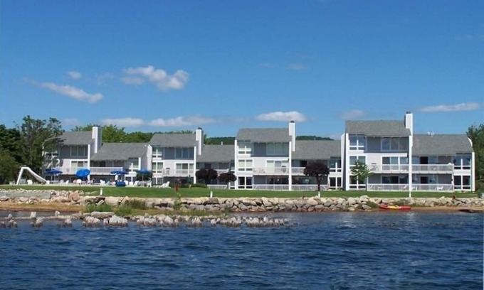 Boyne City Condo | RECENTLY REMODELED directly on Lake Charlevoix Boat Slip Pool Deck Walkout Wifi