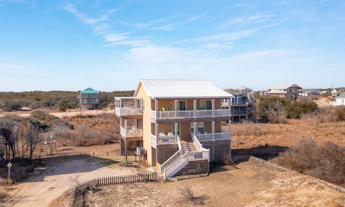 Corolla House | Relax among the dunes and see wild horses from the porch at Shifting Sands!