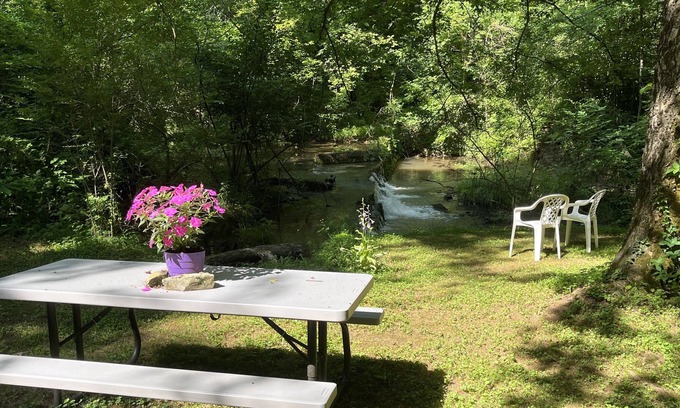 Maryville House | Relax while listening to a Natural Waterfall from your Private Park!