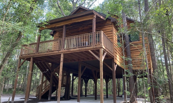 Livingston Cabin | Relax with a view from above in a tree-top getaway! Two Creeks Crossing Resort