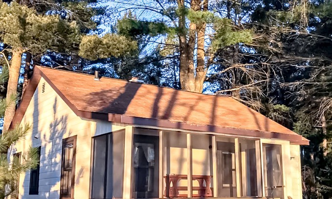 Presque Isle Cabin | Relaxing lake getaway with water views, on-site swimming, fishing, & boating