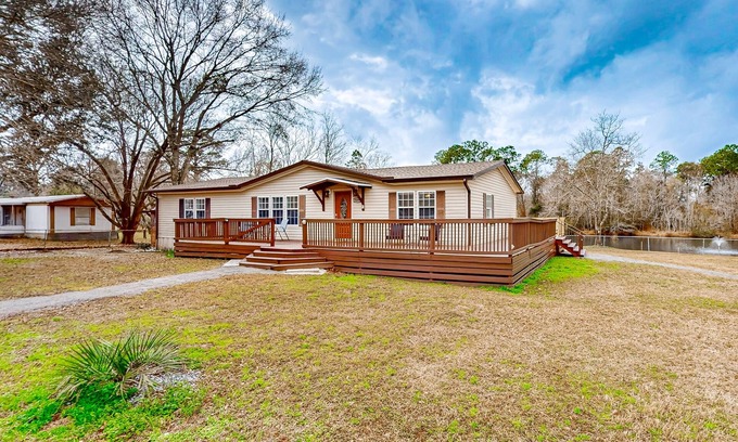 Beulah House | Relaxing lakefront retreat with kayaks, wraparound deck & firepit - dog-friendly