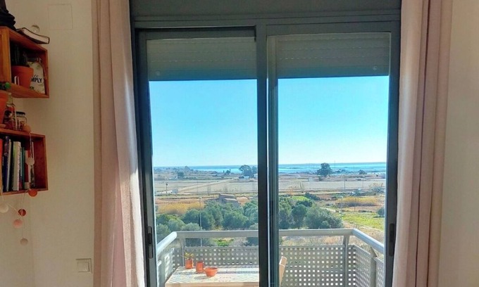 Sant Carles de la Rapita Apartment | Relaxing stay with panoramic Delta and harbour views.