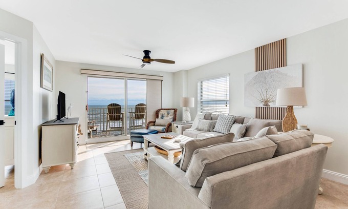 Seawinds Condo Condo | Renovated direct oceanfront corner condo with a large balcony, heated pool, and garage