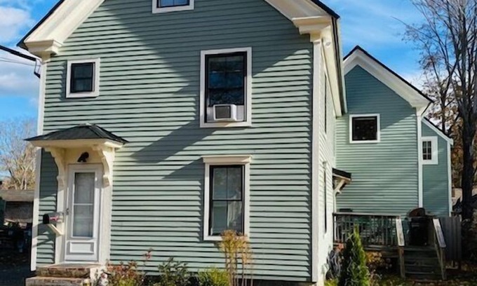 Kennebunk House | Renovated farmhouse featuring two connected rental units with an interior access door. Large Yard