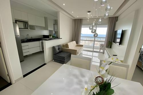 Gonzaga Apartment | Requinte, vista mar, sauna e piscina!