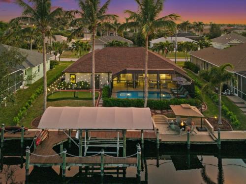 Pelican Villa | Resort Style House with Canal, Heated Pool, Games