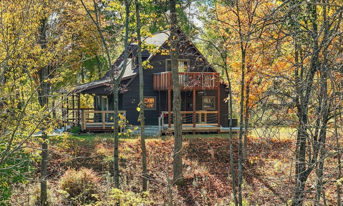 Reed City Ski Chalet | Riverfront | Hot Tub, Fireplace, Kayaks & Tubes
