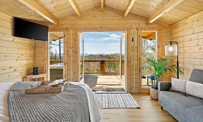 Marion Cabin | Romantic Treehouse with Hot Tub, Waterfall, Hiking, Swinging Bridge & Goats