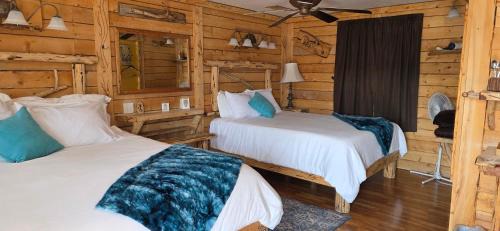 Cedaredge Cabin | Room with 1 King bed and 1 Queen bed at the Cedaredge Lodge