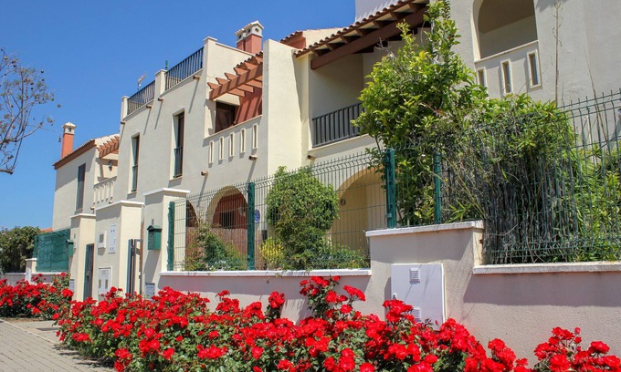 Costa Esuri Ski Chalet | ROU002 Townhouse with Private Garden and Direct Access to the Pool