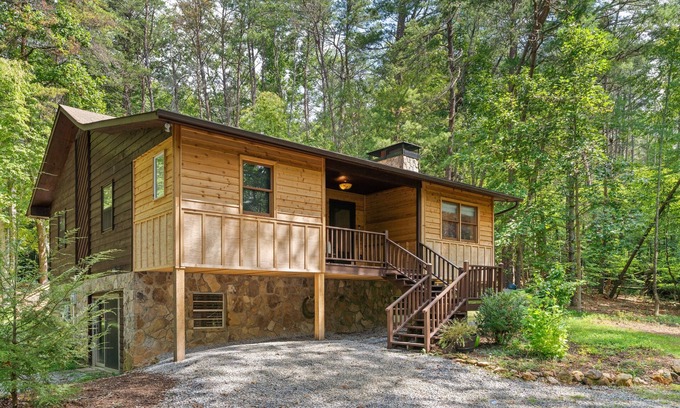 Blairsville Cabin | Rural cabin in wooded lot with firepit, fireplace, grill, wraparound deck, W/D