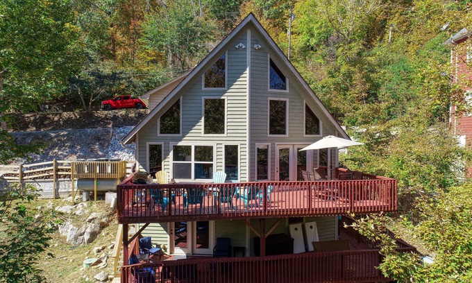 Speedwell Cabin | Rustic Lakefront Cabin with private double-deck dock, slide, hot tub, more!