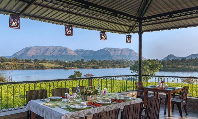 Mahiravani Villa | SaffronStays Lake House Bouganvillea, Nashik - rustic pool villa with great lake views and patio dining