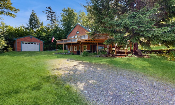 Greenville House | Scenic retreat with a spacious deck, gas fireplace, and Moosehead Lake views