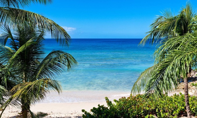 Schooner Bay Apartment | Schooner bay is a beachfront condominium with a freeform swimming pool as the focal point