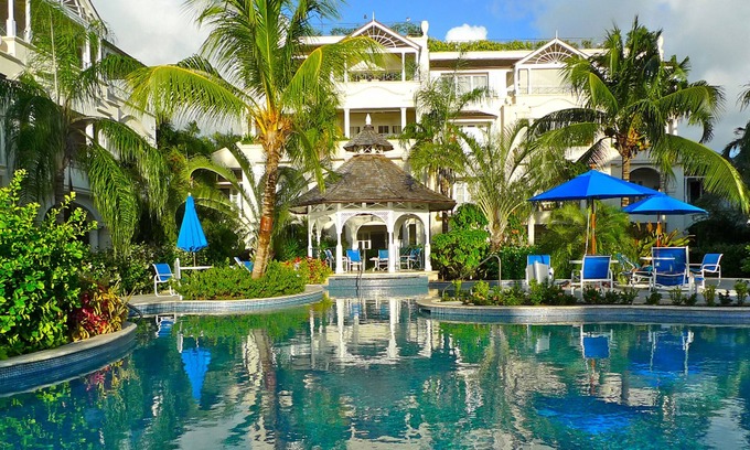Schooner Bay Apartment | Schooner bay is a beachfront condominium with a freeform swimming pool as the focal point
