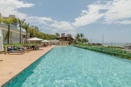 Itacolomi Apartment | Seafront condominium with pool - SHC
