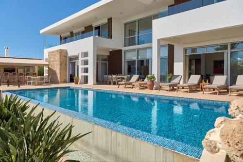 Pegeia Villa | Seafront Villa Kyma by Ezoria Villas