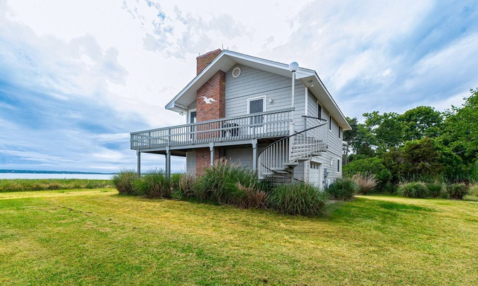 Southold House | Serene bay front home with a private beach, deck, board games, & washer/dryer