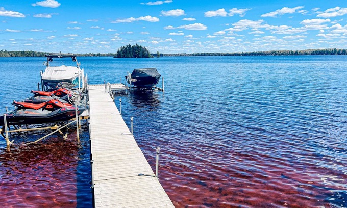 Three Lakes House | Serene lakefront retreat with wet bar, wraparound decks, dock, fireplaces, AC
