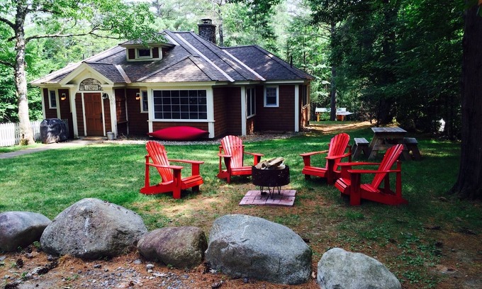 Lake Placid Club House | Short walk to village.with private wooded setting. EV Charger in parking area.