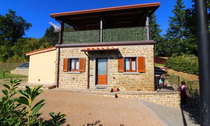 Castel Focognano Villa | Small stone house with panoramic terrace and splendid view over the green woods of the Casentino val