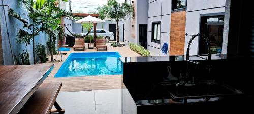 Muquem House | Sobrado com 3 Suítes, Piscina, Sala de Jogos, Playground, Garagem para 4 Carros
