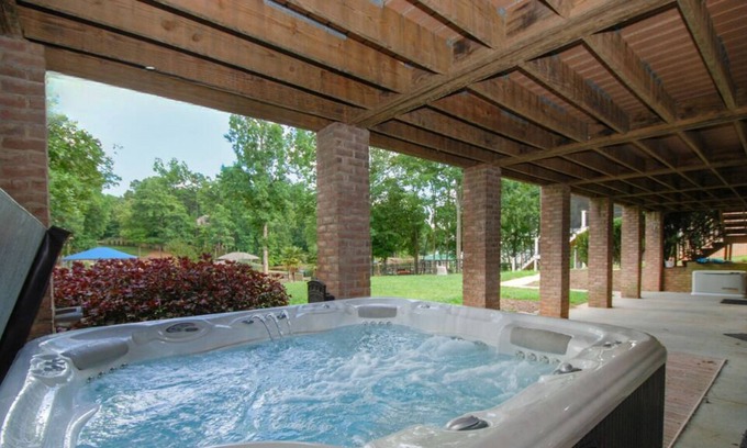 Terrell House | Southern Exposure - Charming Lake Front Home - Private Dock, Screened in Porch, Hot Tub
