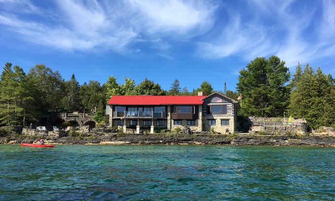 Lion's Head Cottage | Spectacular views- Stone Cottage, steps to the water, heated pool, pet friendlyn