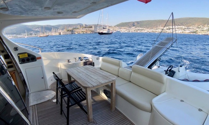 Bodrum City Center Boat Rental | Stay at a luxury crewed 2011 Azimut 55 Fly yacht in Bodrum 3 cabins for 6 guests