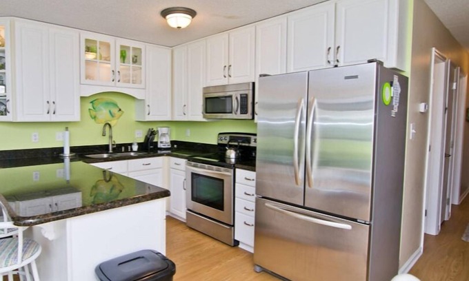 Emerald Isle Condo | Steps away from the Ocean, Gym, Gazebos, Indoor/Outdoor Pools, & Tennis Courts