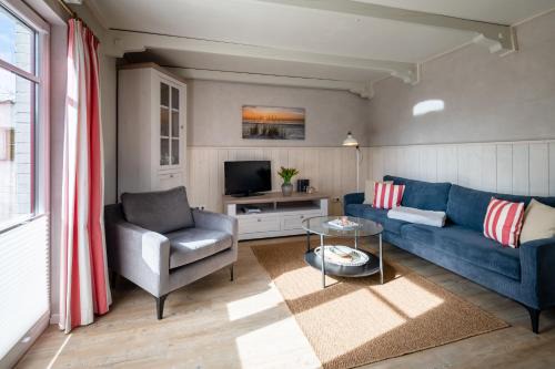 Suederhafen Apartment | Stilvolles Kapteins Cottage mit Kamin - Inge