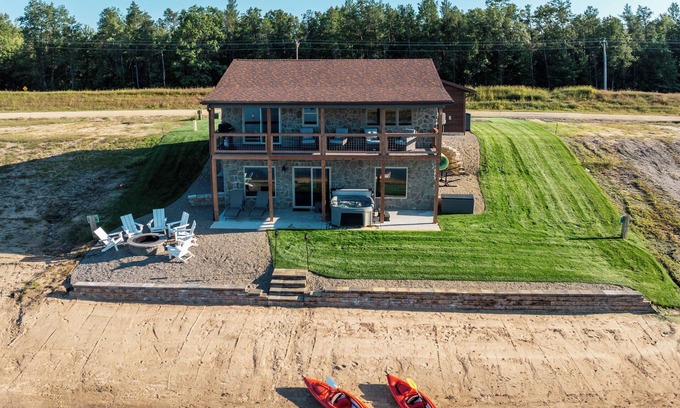 New Lisbon Cottage | Stone Cottage - Lakefront/Beach/Arcade/HotTub/MassageChair/2 Kings/Near WI Dells
