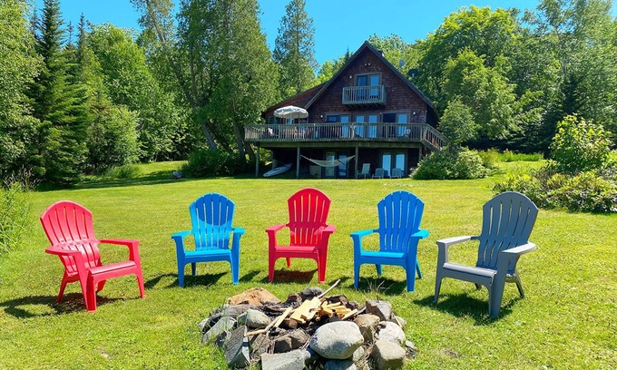 Rangeley House | Stone - This Rangeley Lake home has a very level entry to the water with a huge deck!