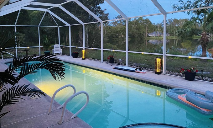 Palm Coast House | Stunning Lake house,heated pool, pet friendly,close to beach, restaurants ,bars