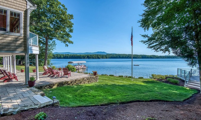 Moultonborough House | Stunning lakefront property with beach access, a dock, spacious yard, & W/D