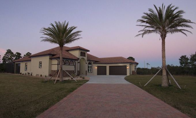 Grant-Valkaria Villa | Stunning Mediterranean-style estate with spillover hot tub/pool! Atlantic Oasis!