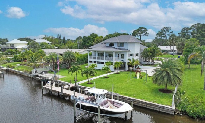 Palm City House | Stunning Water Front River House with Gourmet Kitchen & Large Boat Dock!