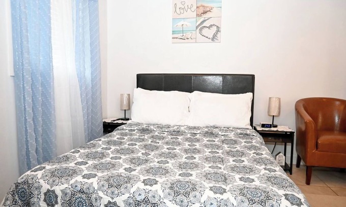 Rock Sound Apartment | Stylish Island Stay| Private Patio + A/C + Wine