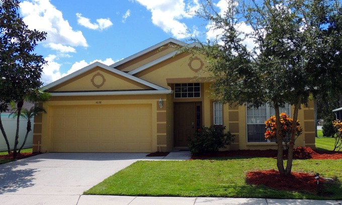 Sabal Harbour Villa | Stylish Lakefront Villa with South Facing Pool. A short drive to fine beaches.